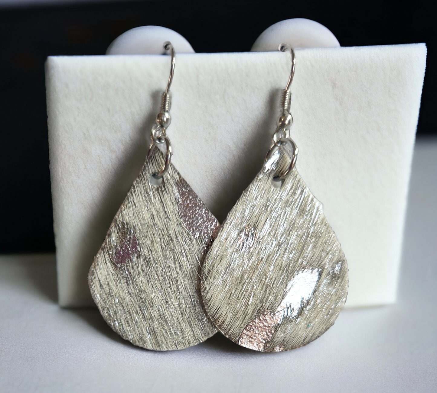 Silver Hair on Leather Teardrops