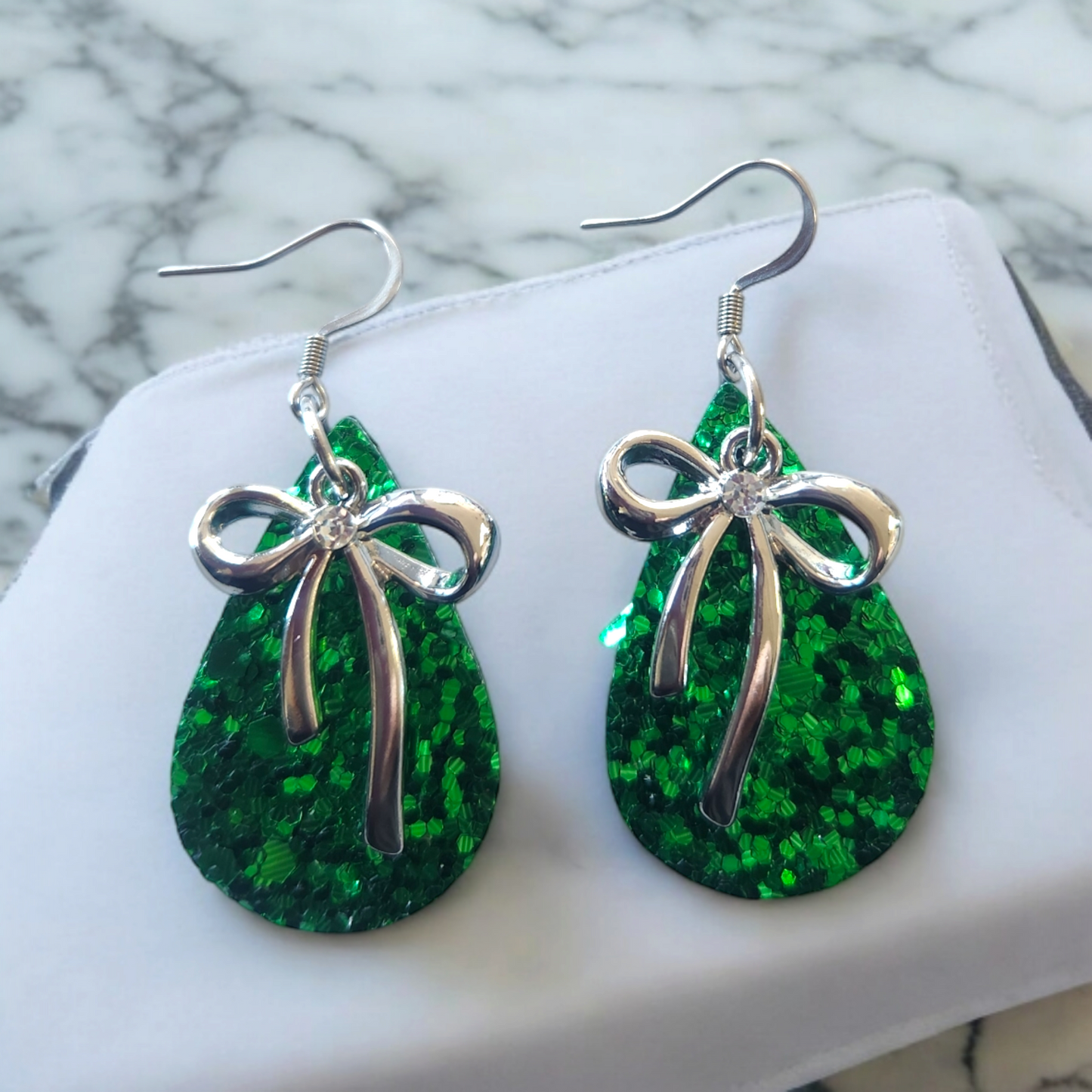 Glitter teardrops with white alloy accented bow