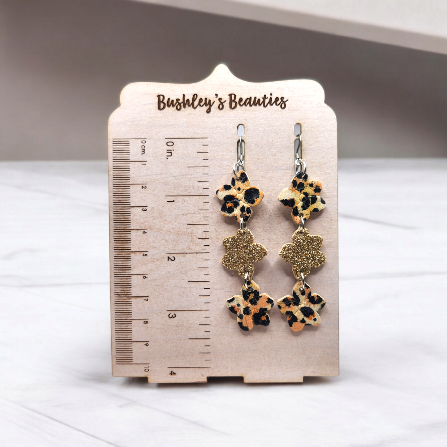 Embossed stacked Flowers orange leopard and Gold