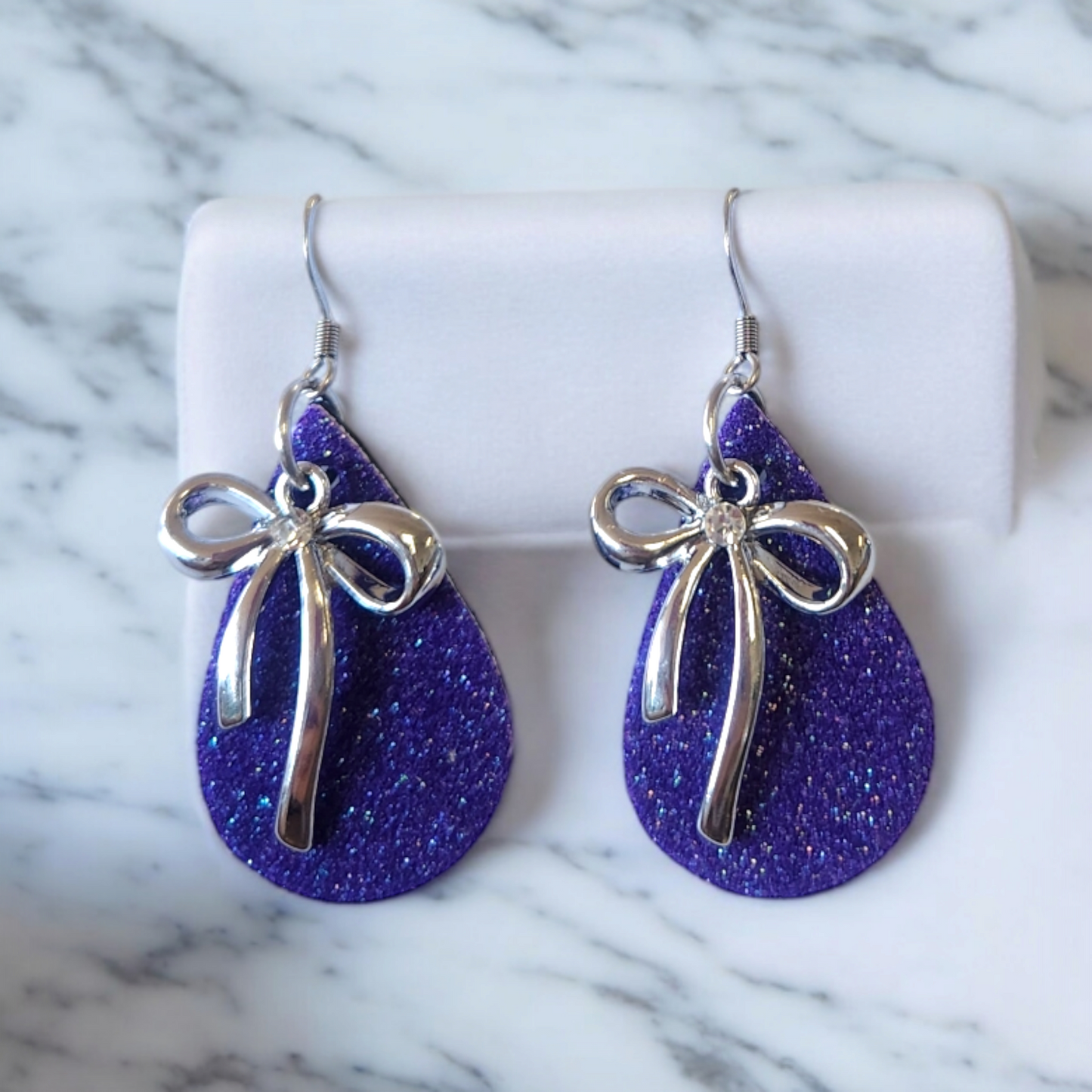 Glitter teardrops with white alloy accented bow