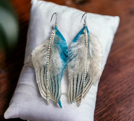 Teal Blue Suede Feather accented with genuine black and white striped feathers