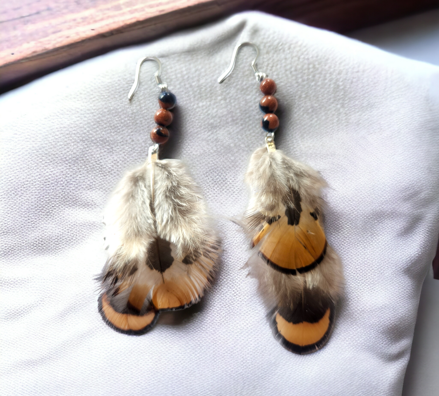 Brown and Tan genuine feather accented with brown and black beads