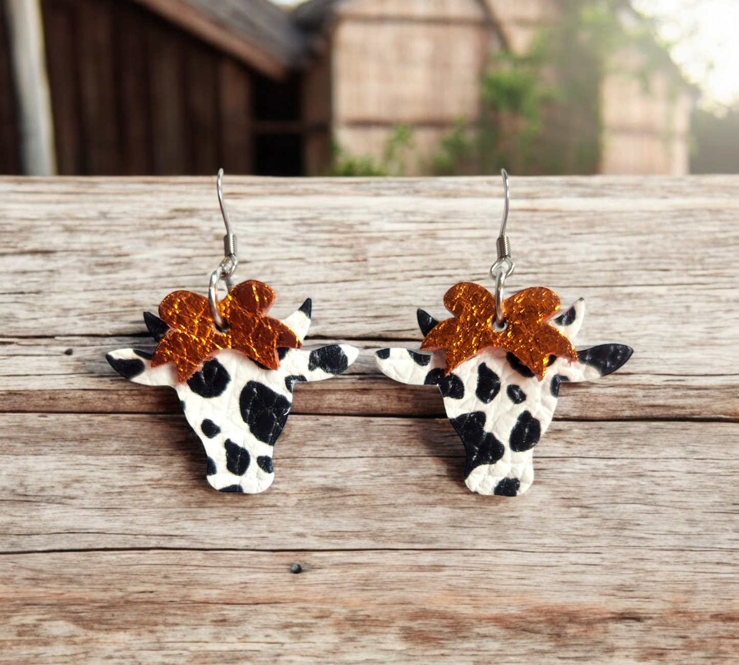 Black and white Cows with Orange Bows