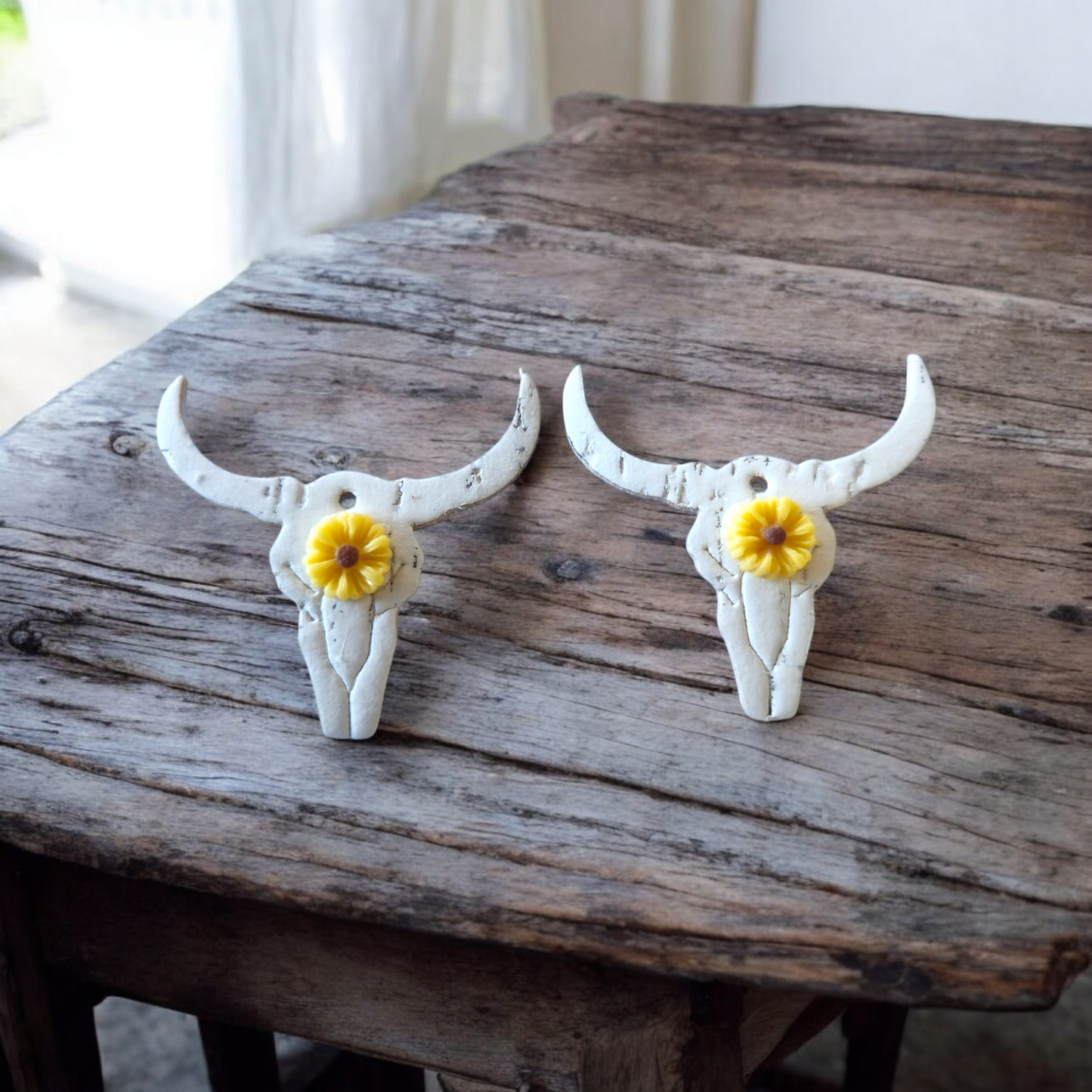 White skulls with yellow sunflowers