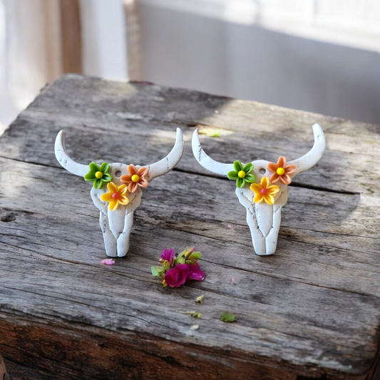 White Bull skulls with green, yellow and brown flowers