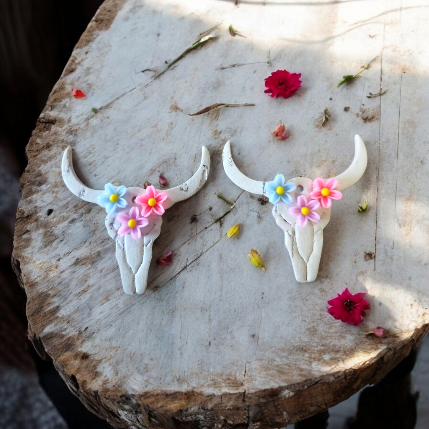 White Bull skulls with blue, purple and pink flowers