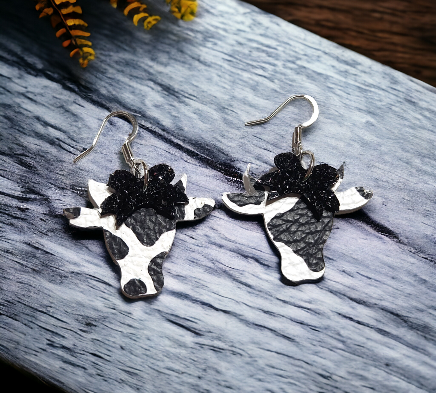 Black and white cows with black glitter bow